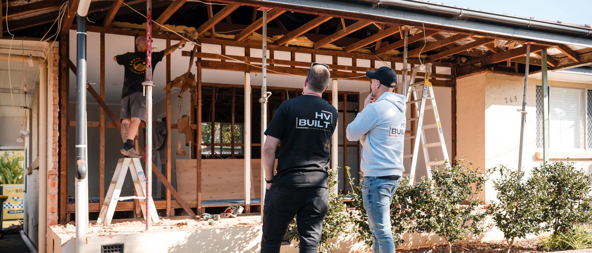 Max and Nathan overseeing a home renovation on site