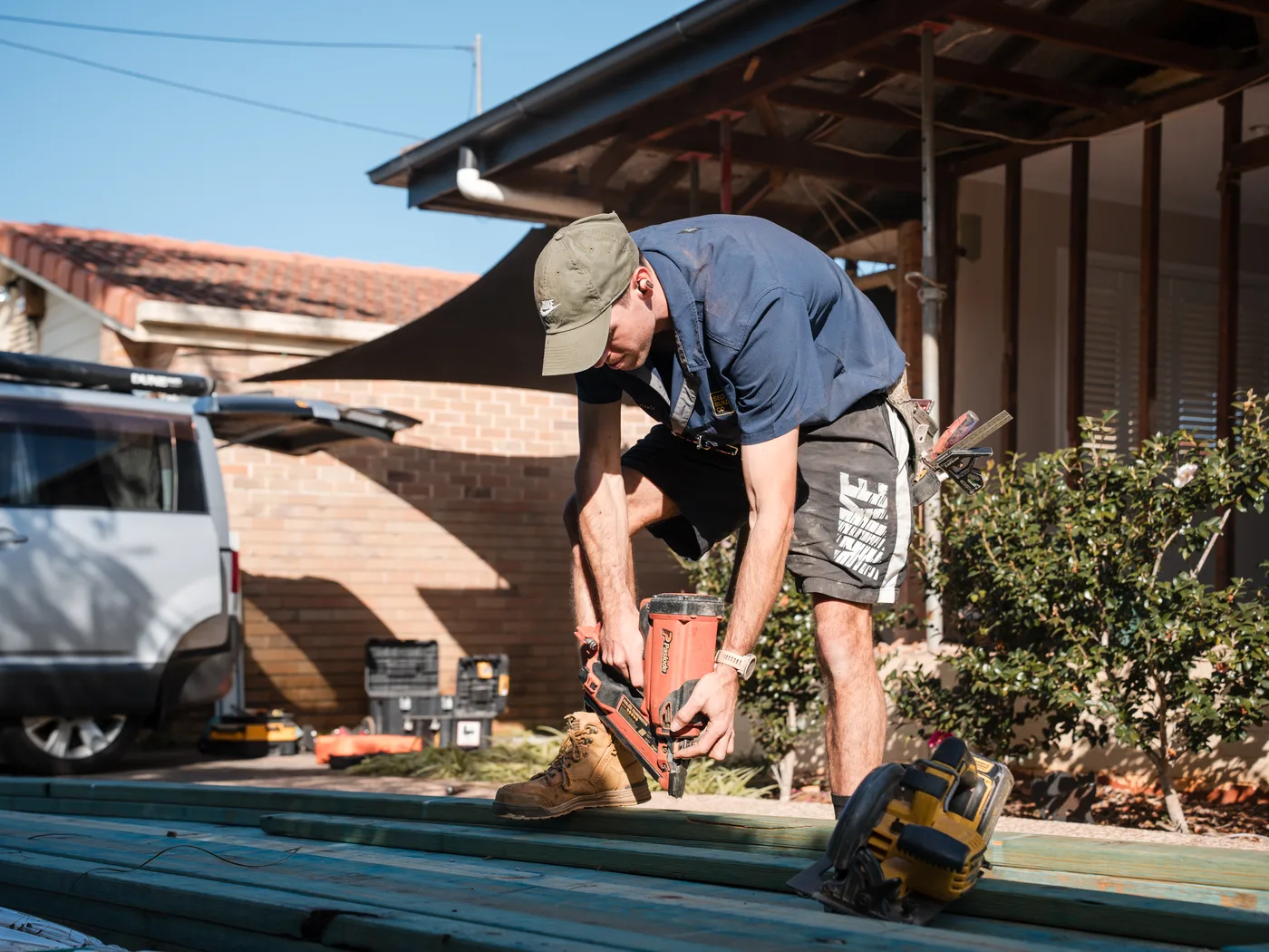 Carpenter fixing timber framing on an HV Built renovation